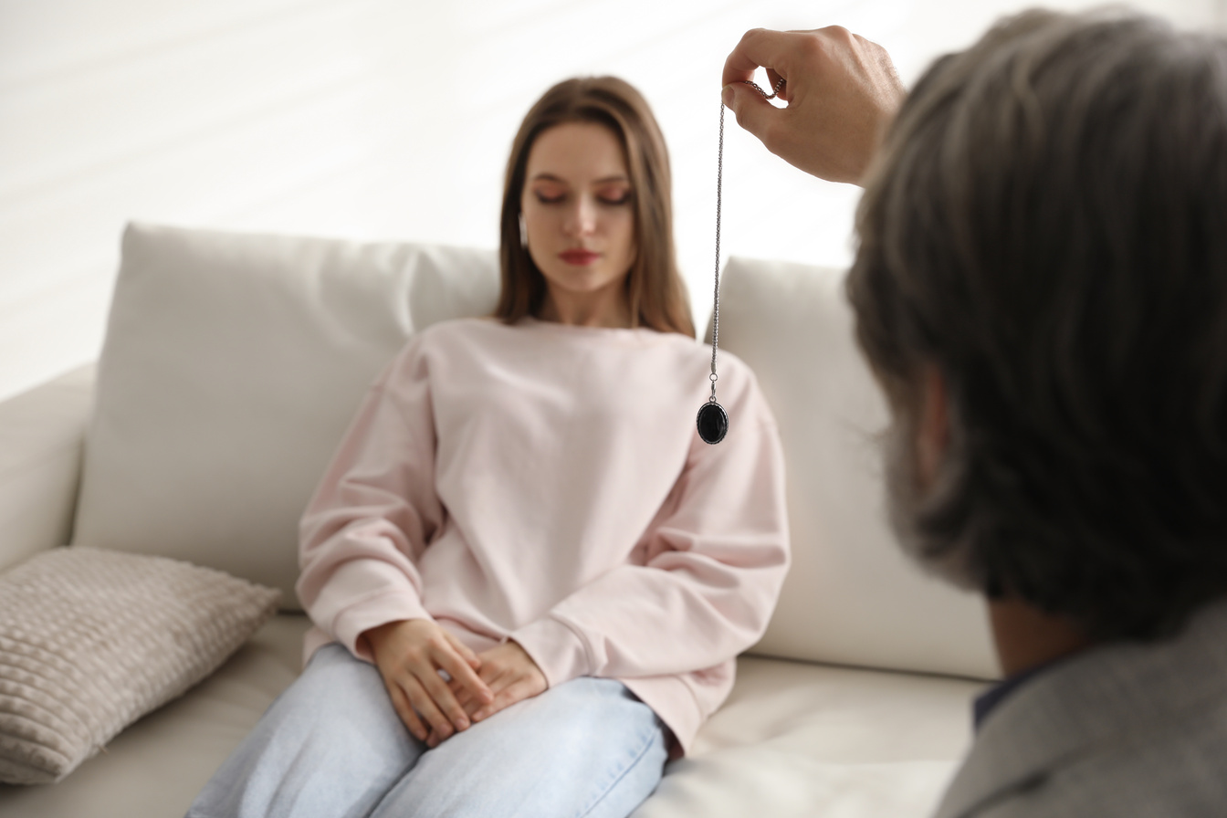 Psychotherapist Using Pendulum during Hypnotherapy   Session in